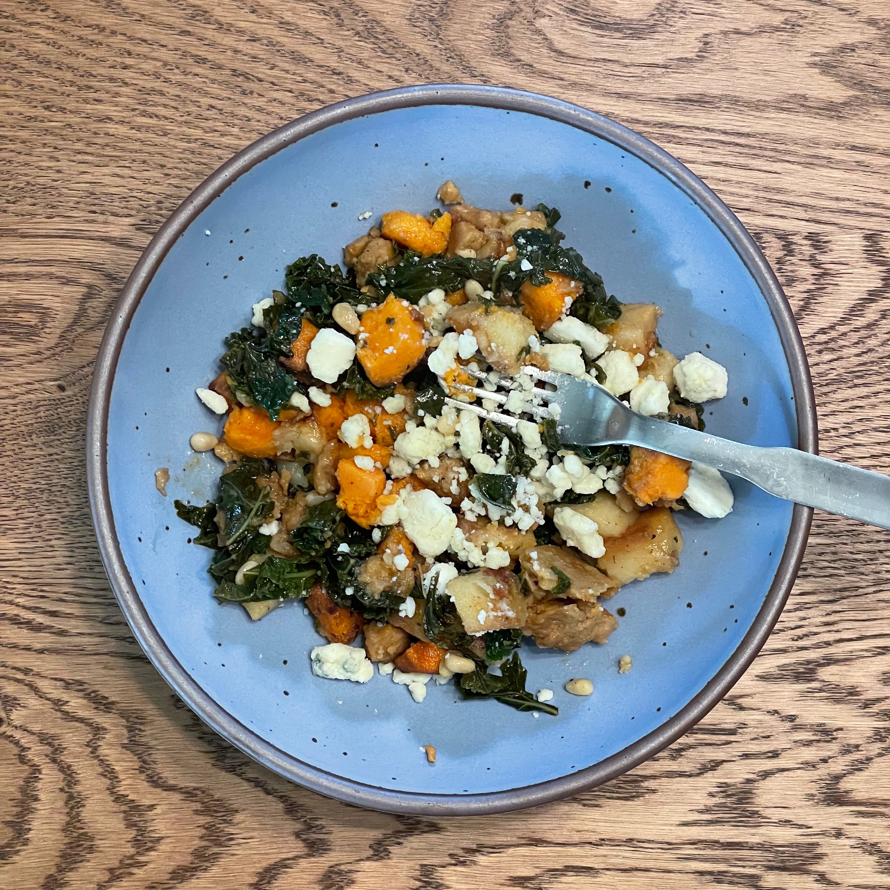 Kale prepared with seitan, potatoes, and follow your heart blue cheese